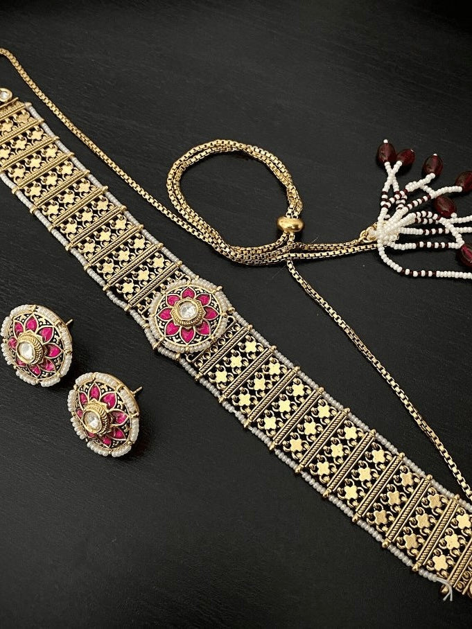 close-up of high-neck antique gold choker with bold ethnic craftsmanship